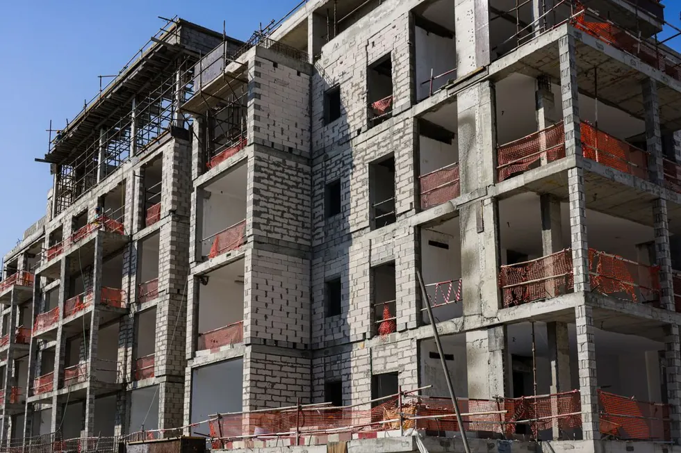 Multifamily building shell under construction with concrete block walls